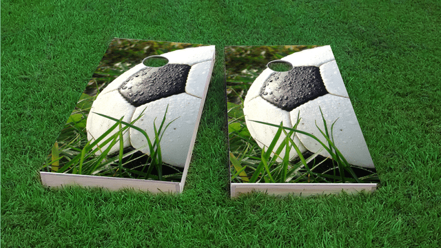 Soccer Ball in Grass Themed Custom Cornhole Board Design