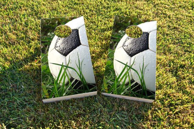 Soccer Ball in Grass Themed Custom Cornhole Board Design