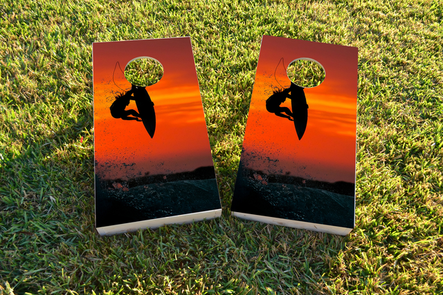 Surfer with Red Sky Themed Custom Cornhole Board Design