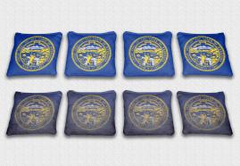 Nebraska State Flag Set themed specialty custom cornhole bags featuring a standard and worn / distressed flag.