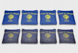 Oregon State Flag Set themed specialty custom cornhole bags featuring a standard and worn / distressed flag.